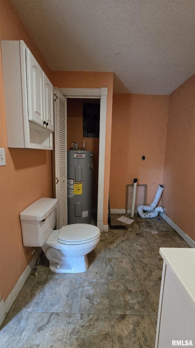 711 Mclean St, Rosiclare, IL 62982 - bathroom with electric water heater and a textured ceiling