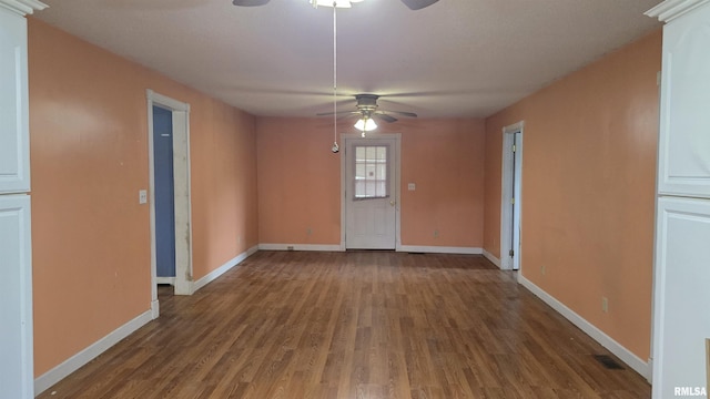 711 Mclean St, Rosiclare, IL 62982 - spare room featuring a ceiling fan and wood finished floors