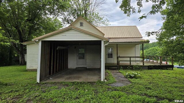 711 Mclean St, Rosiclare, IL 62982 - rear view of property featuring a yard