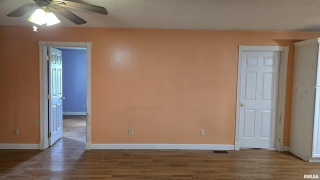 711 Mclean St, Rosiclare, IL 62982 - spare room featuring wood finished floors and ceiling fan