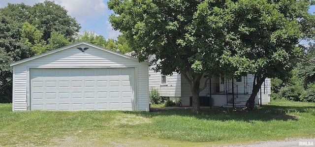 4801 Quail Run Rd, Salem, IL 62881 - view of front facade with a garage, an outbuilding, and a front lawn