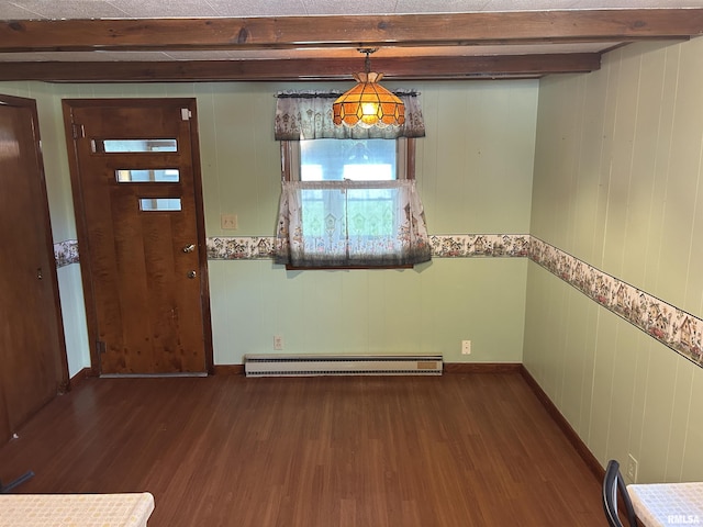 1026 E Noleman St, Centralia, IL 62801 - unfurnished dining area featuring baseboard heating, beam ceiling, and wood finished floors