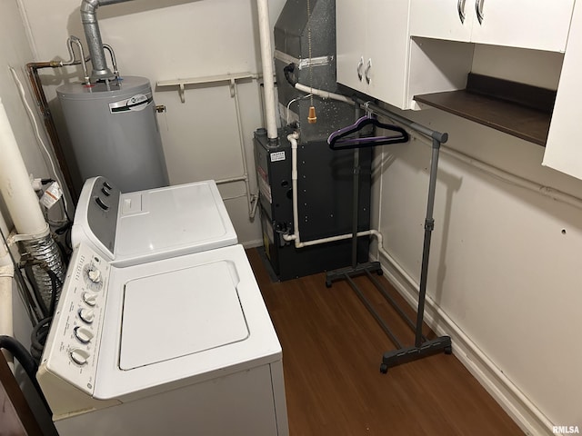 1026 E Noleman St, Centralia, IL 62801 - laundry area with water heater, washer / dryer, dark wood-type flooring, and cabinet space