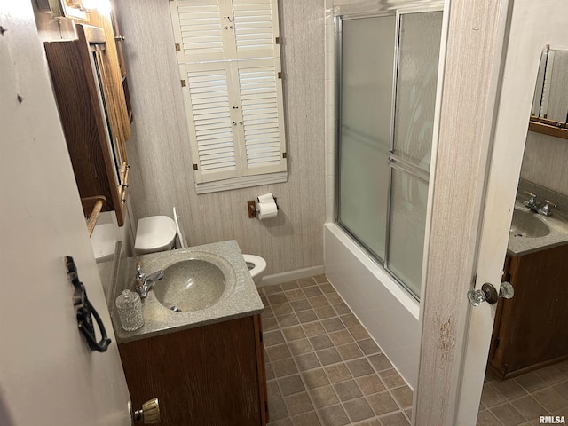 1026 E Noleman St, Centralia, IL 62801 - full bathroom with tile patterned flooring, vanity, and bath / shower combo with glass door