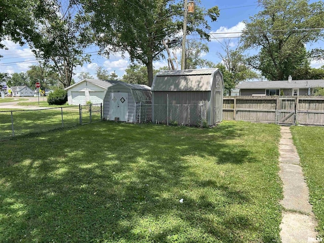 1026 E Noleman St, Centralia, IL 62801 - fenced backyard featuring a shed, a detached garage, and a gate