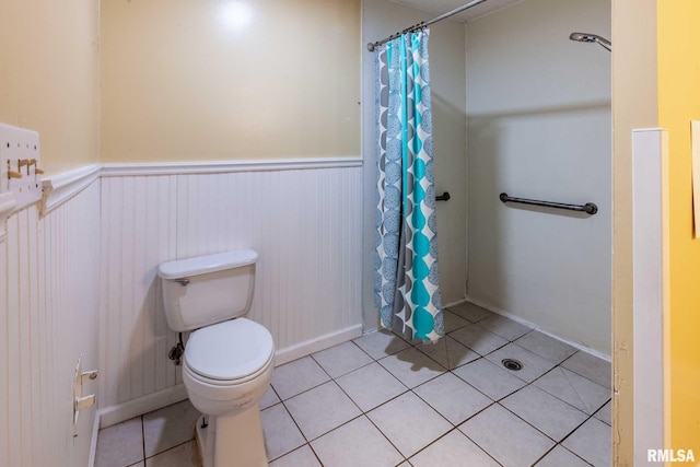 16777 Dublin St, West Frankfort, IL 62896 - bathroom with wainscoting, tile patterned floors, and a shower with shower curtain