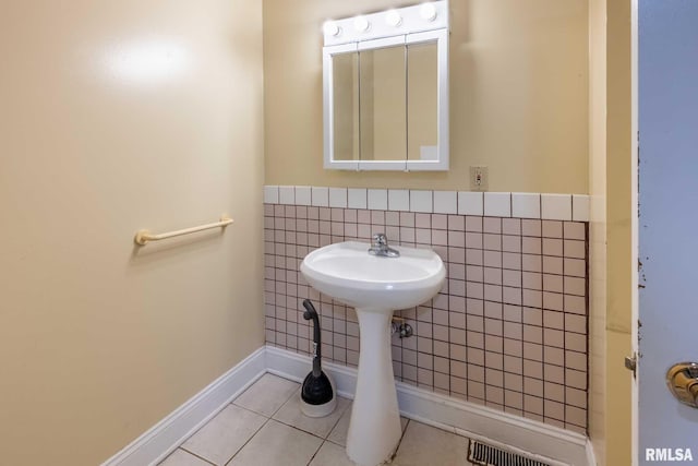 16777 Dublin St, West Frankfort, IL 62896 - bathroom with tile patterned flooring and tile walls