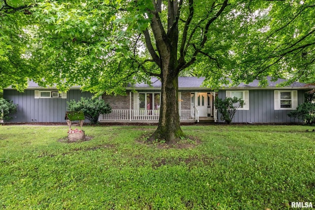 16777 Dublin St, West Frankfort, IL 62896 - single story home with board and batten siding, a front lawn, and a porch