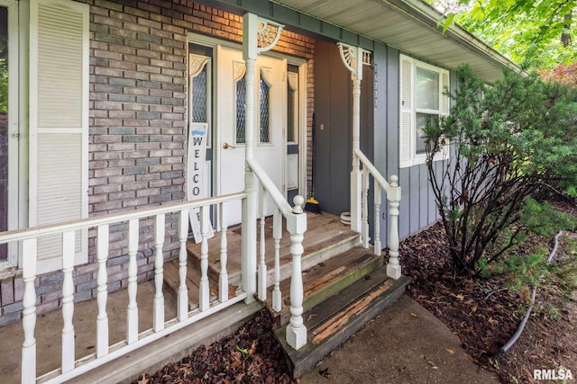 16777 Dublin St, West Frankfort, IL 62896 - doorway to property with brick siding and a porch