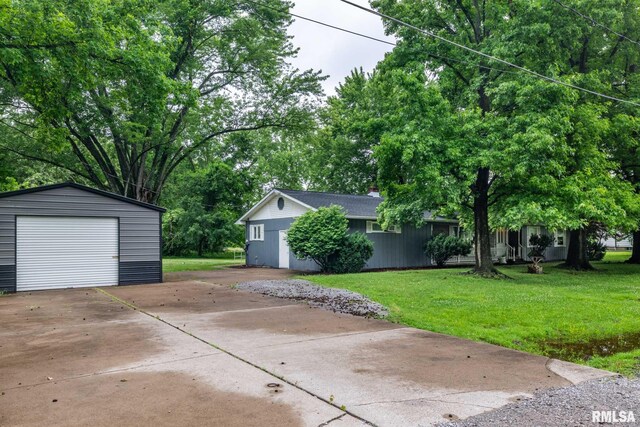 16777 Dublin St, West Frankfort, IL 62896 - view of front of property with driveway, a garage, an outbuilding, and a front lawn