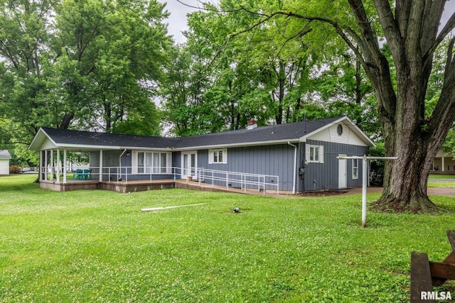 16777 Dublin St, West Frankfort, IL 62896 - single story home featuring board and batten siding, a chimney, and a front yard