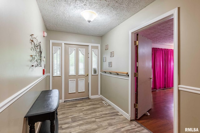 16777 Dublin St, West Frankfort, IL 62896 - foyer with a textured ceiling and wood finished floors
