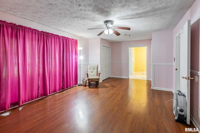 16777 Dublin St, West Frankfort, IL 62896 - empty room with ceiling fan, wood finished floors, and a textured ceiling