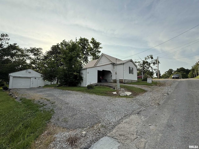 41 Cache Ave, Buncombe, IL 62912 - bungalow-style home with driveway, an outdoor structure, and a garage