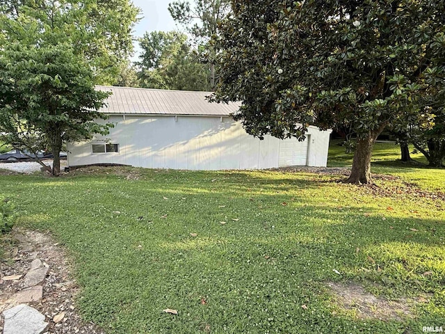 41 Cache Ave, Buncombe, IL 62912 - view of grassy yard featuring an outdoor structure, a garage, and an outbuilding