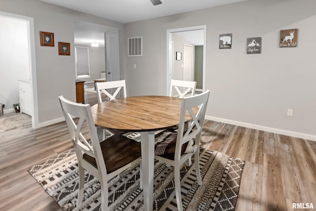 416 S Maple St, Salem, IL 62881 - dining room featuring baseboards and light wood-style flooring
