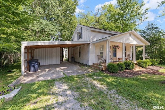 416 S Maple St, Salem, IL 62881 - view of front of home featuring covered porch, a carport, and driveway