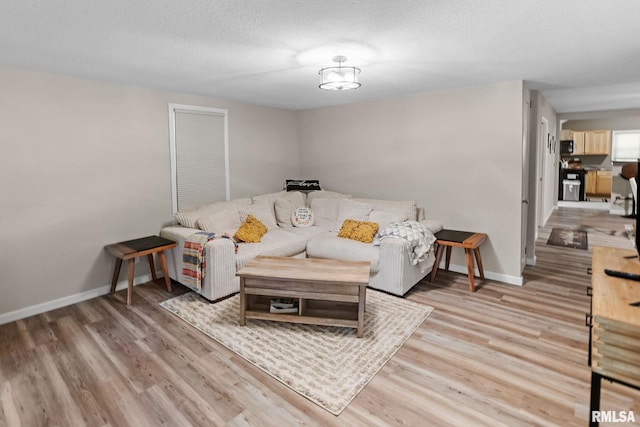 416 S Maple St, Salem, IL 62881 - living room with light wood-style floors and a textured ceiling