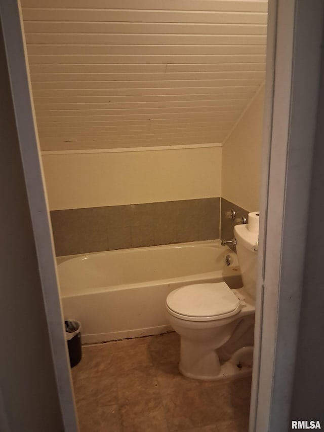 1112 Ophia St, Metropolis, IL 62960 - full bathroom featuring a tub to relax in and vaulted ceiling