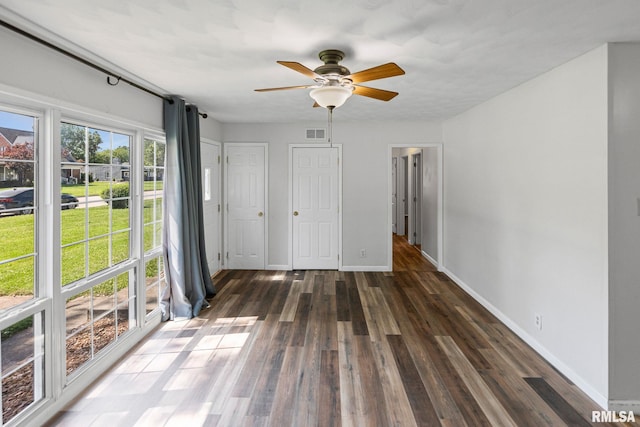 326 N Indiana St, Salem, IL 62881 - unfurnished bedroom featuring wood finished floors and a ceiling fan