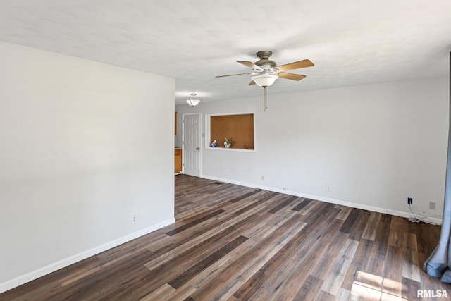 326 N Indiana St, Salem, IL 62881 - empty room with ceiling fan and dark wood-style flooring
