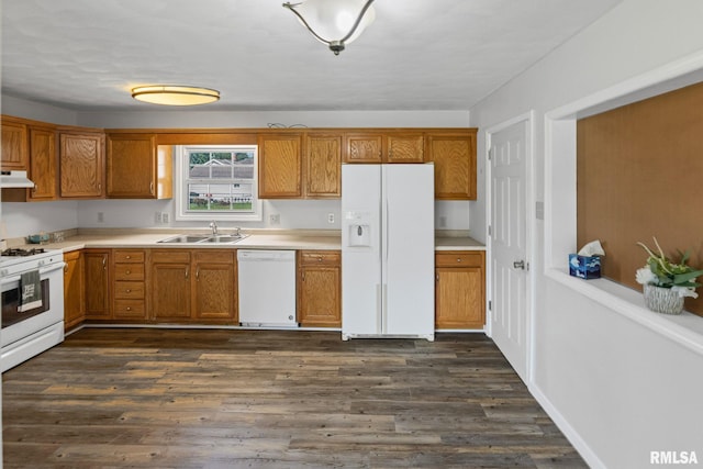 326 N Indiana St, Salem, IL 62881 - kitchen featuring white appliances, under cabinet range hood, brown cabinets, and dark wood-type flooring