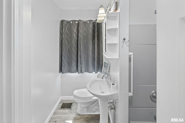 326 N Indiana St, Salem, IL 62881 - bathroom with toilet and wood finished floors