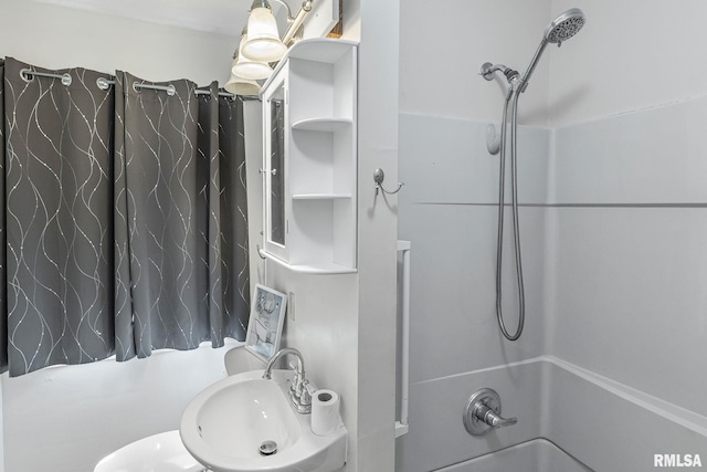 326 N Indiana St, Salem, IL 62881 - bathroom featuring shower / tub combo and a sink