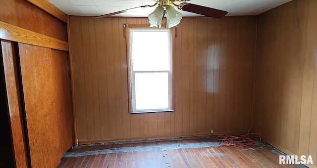 2130 Rains St, Murphysboro, IL 62966 - unfurnished room featuring a ceiling fan, hardwood / wood-style floors, and wooden walls