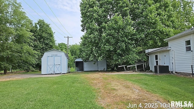 2130 Rains St, Murphysboro, IL 62966 - view of grassy yard featuring a storage unit