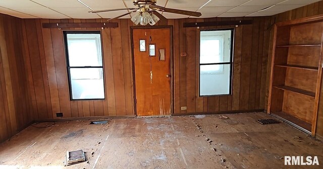 2130 Rains St, Murphysboro, IL 62966 - foyer with wood walls and ceiling fan