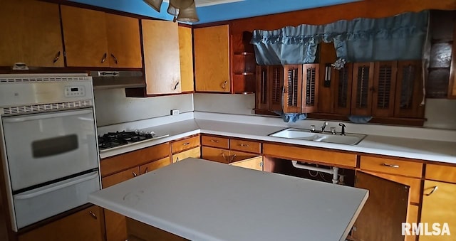 2130 Rains St, Murphysboro, IL 62966 - kitchen featuring a warming drawer, white oven, stainless steel gas stovetop, and light countertops