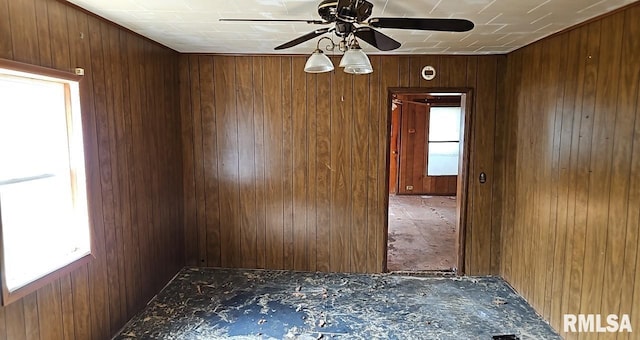 2130 Rains St, Murphysboro, IL 62966 - spare room featuring plenty of natural light, a ceiling fan, and wood walls
