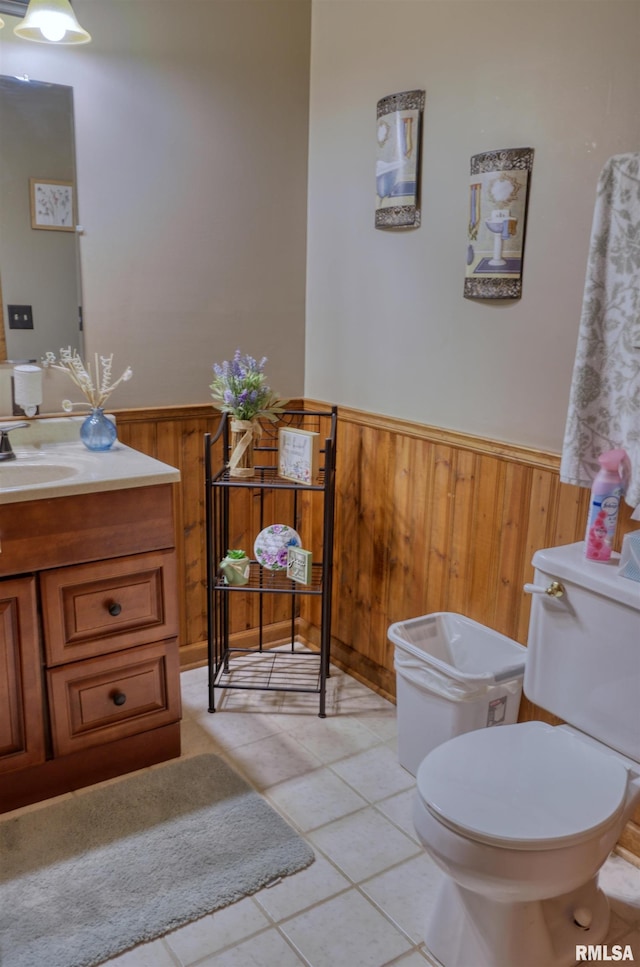 12299 Pebble Point Rd, Marion, IL 62959 - half bathroom featuring a wainscoted wall, vanity, wooden walls, and tile patterned floors
