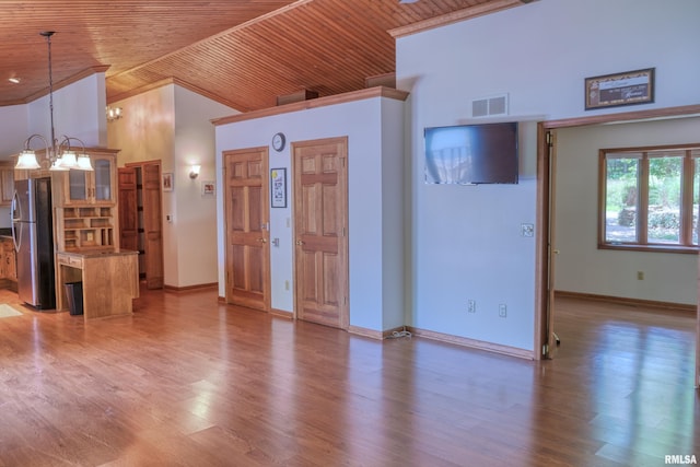 12299 Pebble Point Rd, Marion, IL 62959 - unfurnished living room with wood ceiling, a chandelier, light wood-style flooring, and high vaulted ceiling