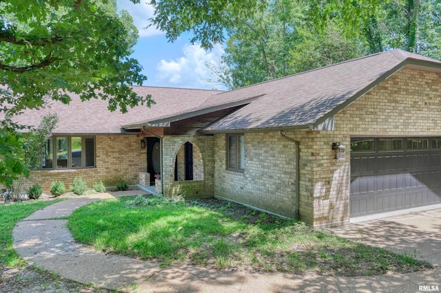 12299 Pebble Point Rd, Marion, IL 62959 - view of front of property with a garage, roof with shingles, and brick siding