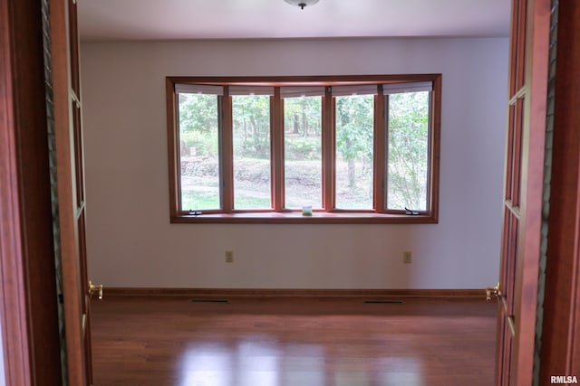 12299 Pebble Point Rd, Marion, IL 62959 - empty room featuring wood finished floors and baseboards