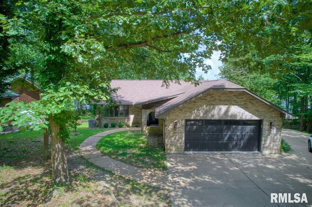 12299 Pebble Point Rd, Marion, IL 62959 - view of front of property with brick siding, driveway, and an attached garage