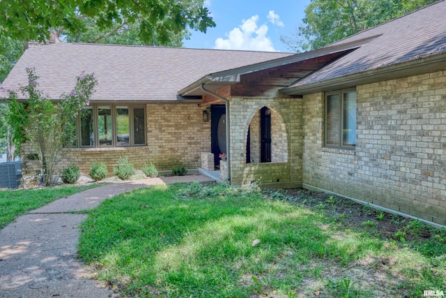 12299 Pebble Point Rd, Marion, IL 62959 - property entrance with roof with shingles and brick siding