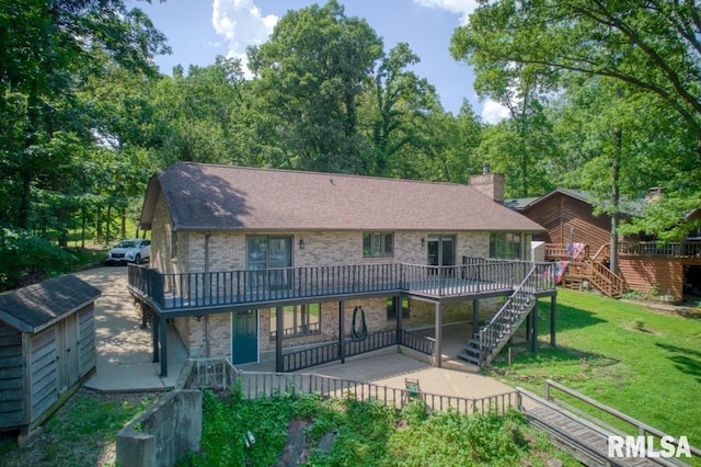 12299 Pebble Point Rd, Marion, IL 62959 - back of property featuring stairs, a wooden deck, and brick siding