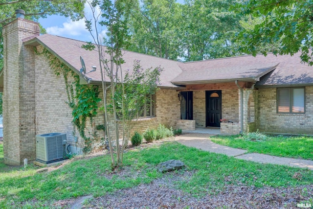 12299 Pebble Point Rd, Marion, IL 62959 - ranch-style home with a chimney, a shingled roof, and brick siding