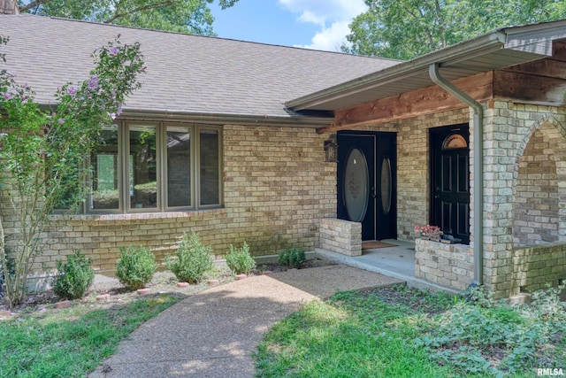 12299 Pebble Point Rd, Marion, IL 62959 - view of exterior entry with a shingled roof and brick siding