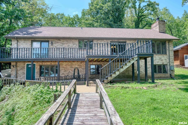 12299 Pebble Point Rd, Marion, IL 62959 - back of house featuring brick siding, a chimney, a yard, and a wooden deck