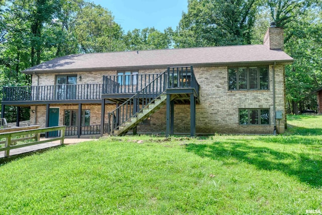 12299 Pebble Point Rd, Marion, IL 62959 - back of property with a chimney, brick siding, a wooden deck, a yard, and stairs