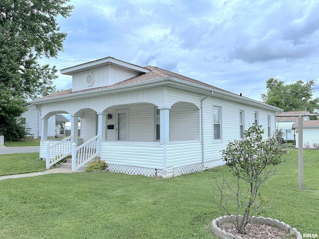 1520 Gartside St, Murphysboro, IL 62966 - view of front facade featuring a porch, a front yard, and a shingled roof
