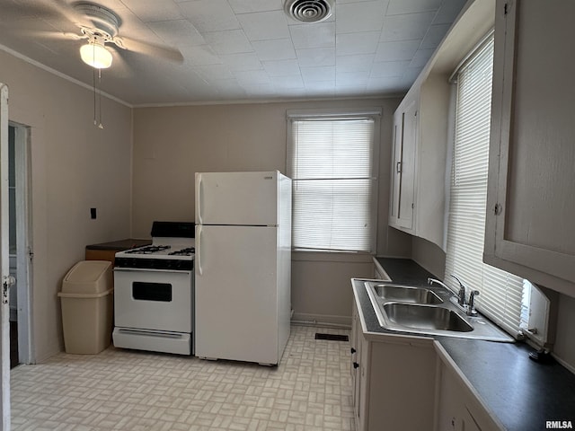 1520 Gartside St, Murphysboro, IL 62966 - kitchen with white appliances, ceiling fan, brick patterned flooring, and crown molding