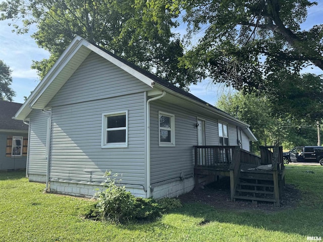 1420 W Cherry St, Herrin, IL 61948 - view of side of home featuring a lawn and a deck
