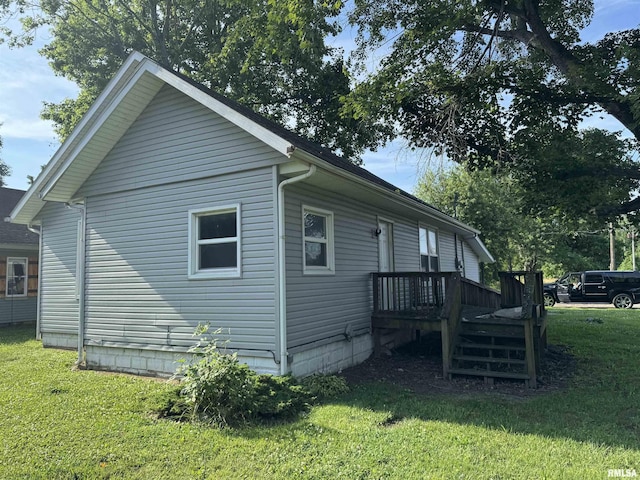 1420 W Cherry St, Herrin, IL 61948 - view of property exterior with a lawn and a deck
