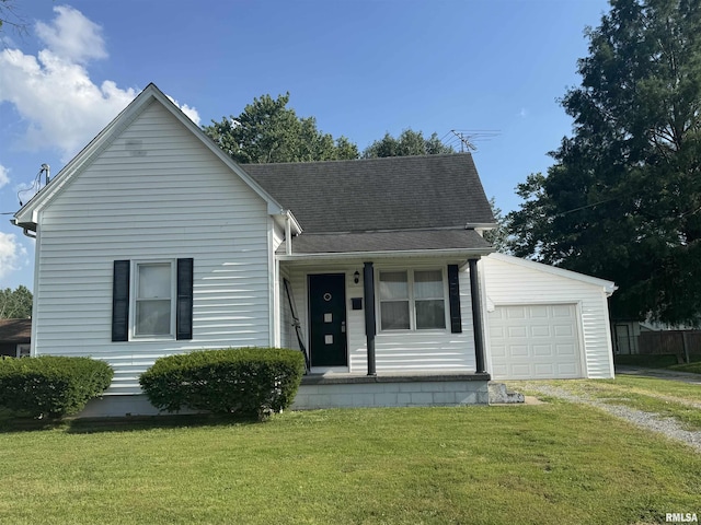 1607 W Cherry St, Marion, IL 62959 - view of front of house featuring driveway, a front yard, a shingled roof, covered porch, and a garage