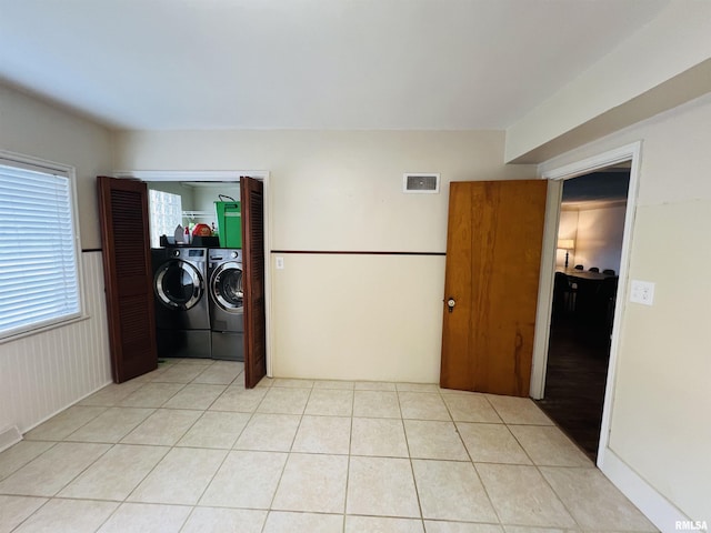 385 3rd St, Omaha, IL 62871 - laundry room with washing machine and clothes dryer and light tile patterned flooring